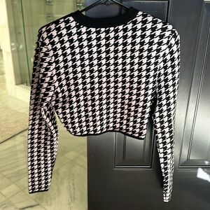 Tags not on but it’s never been worn!! Has padded shoulders.